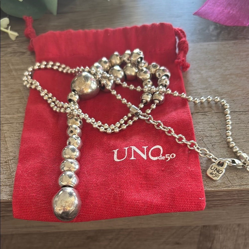 Uno de50 Silver, Thick Beaded Necklace and jewelry bag.